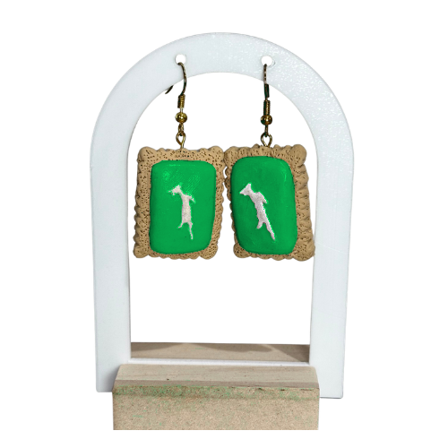 Green polymer clay earrings  on white stand