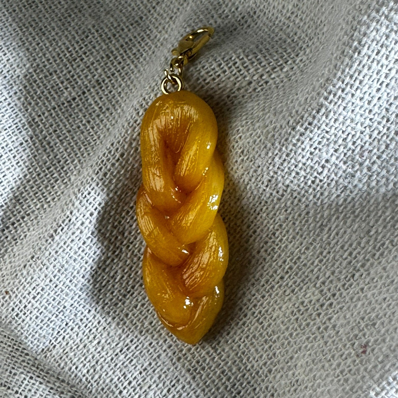 hand sculpted polymer clay koeksister charm