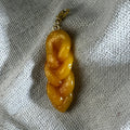 hand sculpted polymer clay koeksister charm