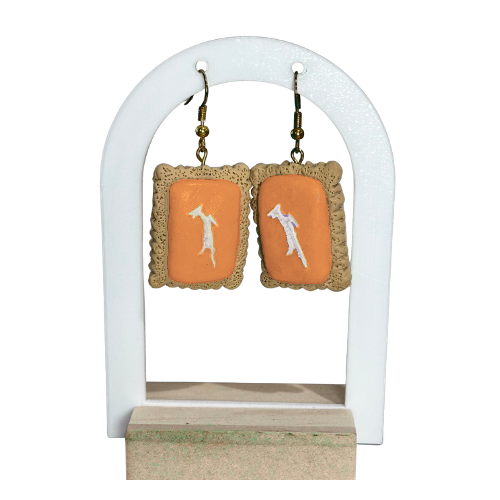 Orange hand-sculpted polymer clay zoo cookie earrings with springbok on